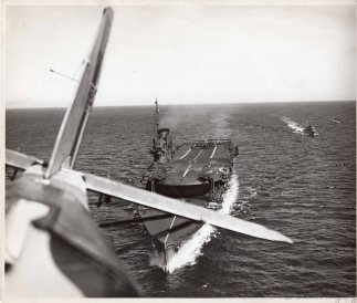 A veiw of HMS Courageous over the tail of an aircraft